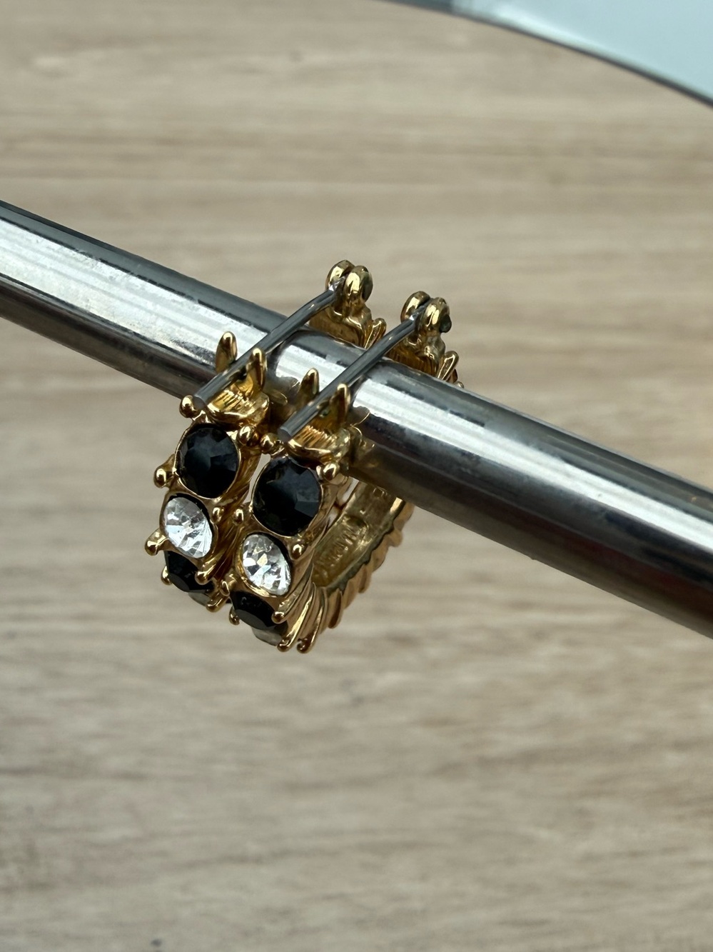 Napier Black and Clear Rhinestone Earrings in Gold Tone Setting.